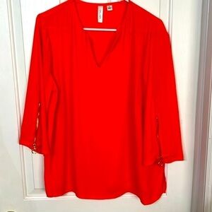Tacera top, orange, ladies size L.Zipper accents ok 3/4 sleeves, pull over top.